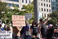 Woman Holds a Sign That Says, Ã¢â¬ÅStop Manhandling WomenÃ¢â¬â¢s RightsÃ¢â¬Â at the WomenÃ¢â¬â¢s March at Freedom Plaza Royalty Free Stock Photo